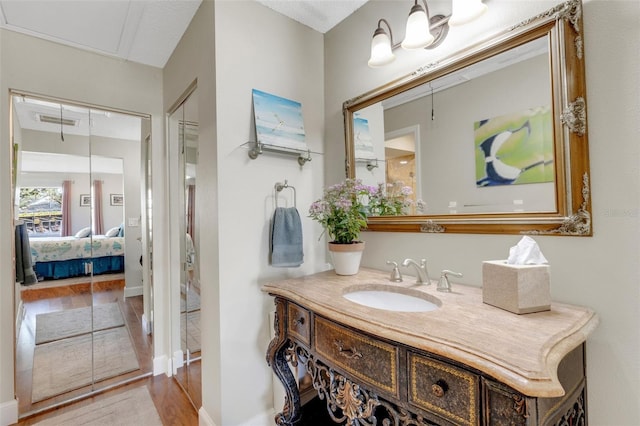 bathroom featuring vanity and wood-type flooring