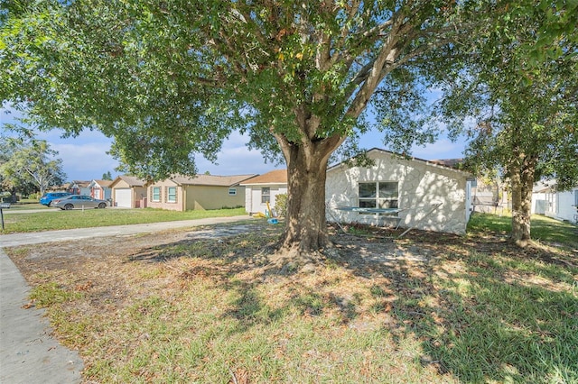 ranch-style home with a front yard