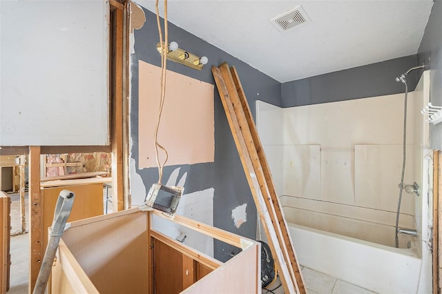 bathroom with shower / tub combination and tile patterned flooring