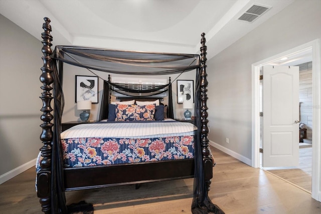 bedroom with hardwood / wood-style flooring