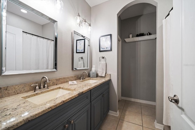 bathroom featuring tile patterned floors and vanity