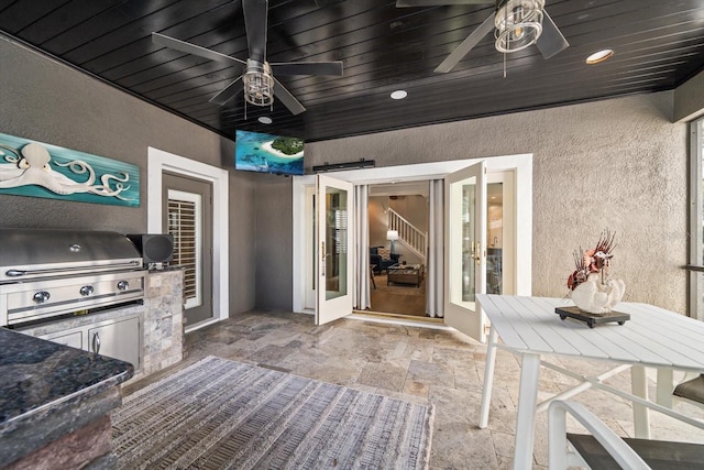 view of patio featuring area for grilling, ceiling fan, and grilling area