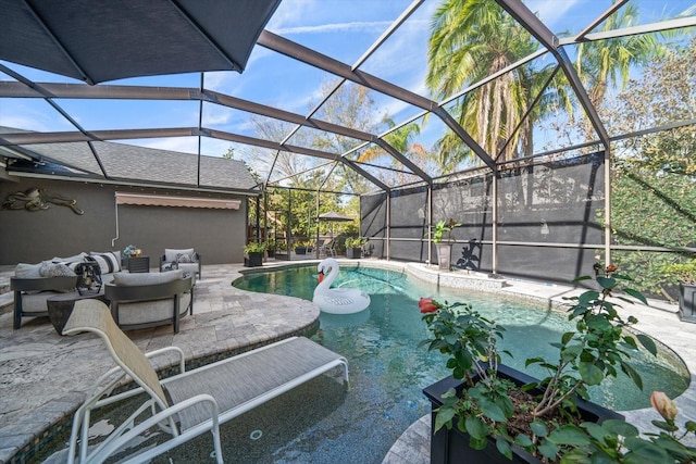 view of swimming pool with a patio, glass enclosure, and an outdoor hangout area