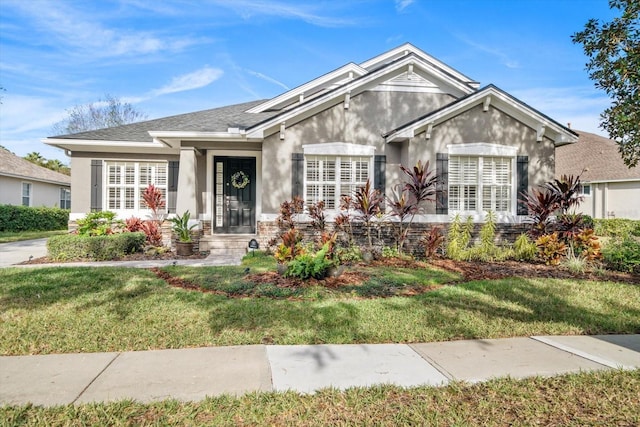 view of front of property with a front lawn