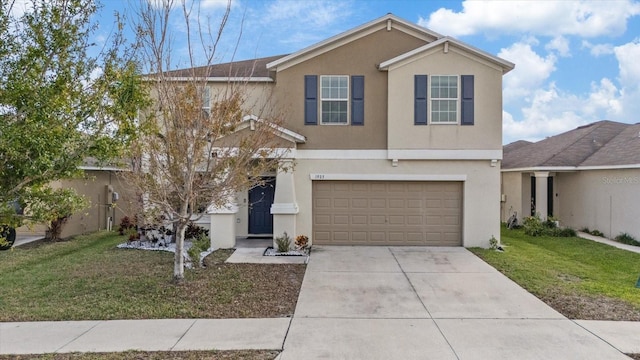 view of front property with a front yard and a garage