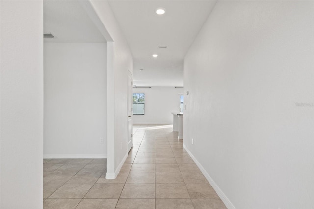 hallway with light tile patterned floors