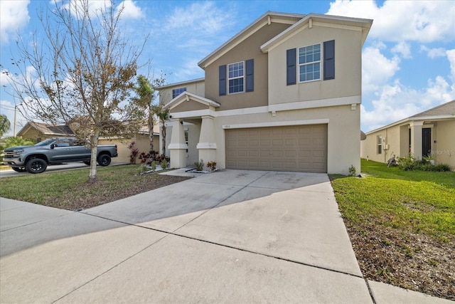 view of front property with a garage and a front lawn