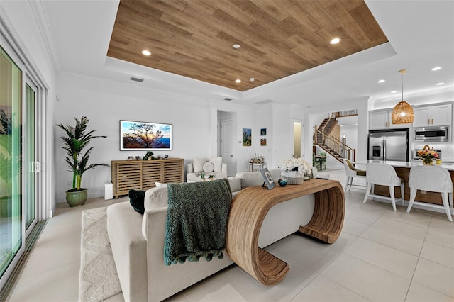 interior space with wood ceiling, a tray ceiling, and stainless steel fridge with ice dispenser