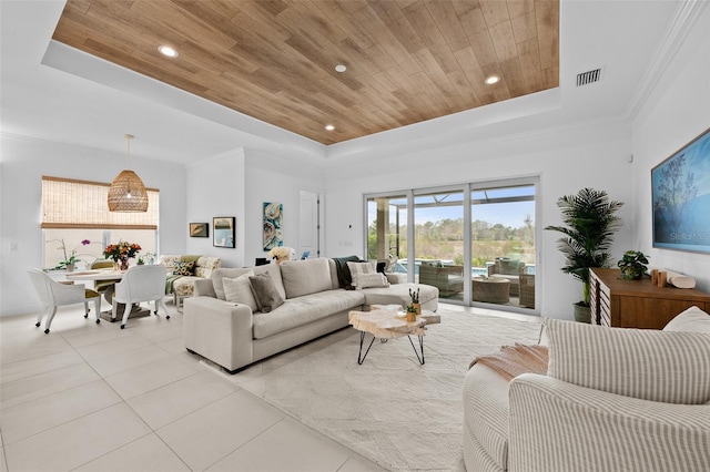 living room with a raised ceiling, light tile patterned floors, and wood ceiling