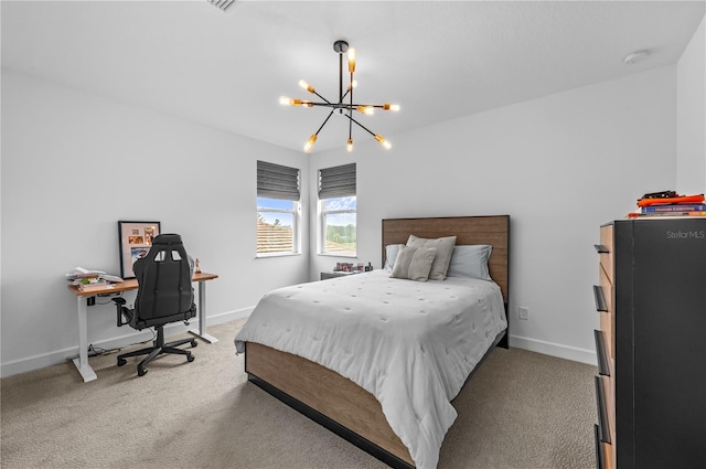 bedroom with a chandelier and carpet