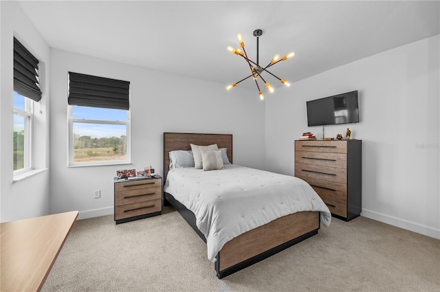 carpeted bedroom with an inviting chandelier