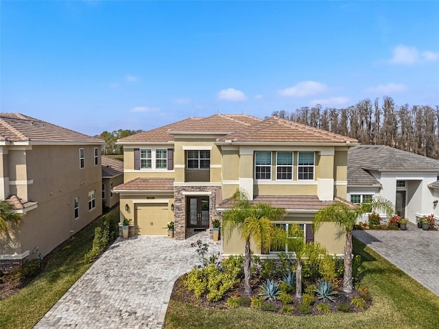 view of front of home featuring a garage and a front lawn