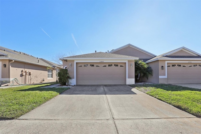 single story home with a garage and a front yard