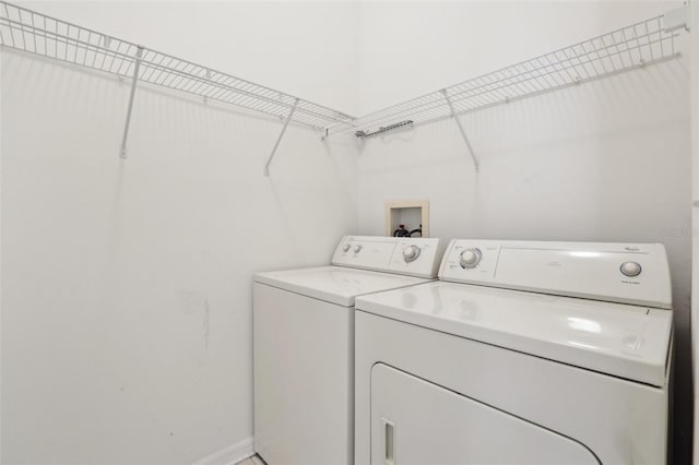 clothes washing area featuring washing machine and clothes dryer