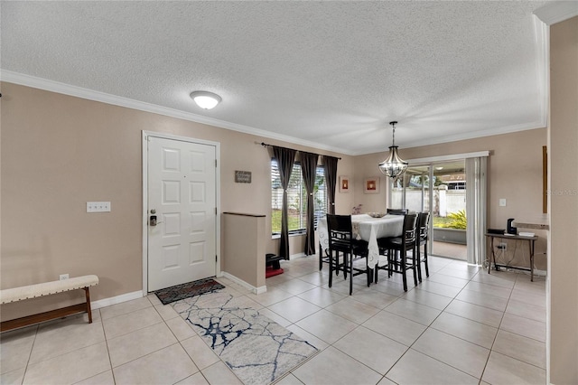 dining room featuring light tile patterned floors and crown molding