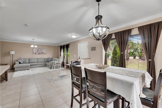 dining room featuring an inviting chandelier, a healthy amount of sunlight, light tile patterned floors, and ornamental molding