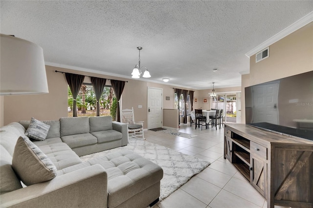 living room featuring light tile patterned floors, an inviting chandelier, a wealth of natural light, and crown molding