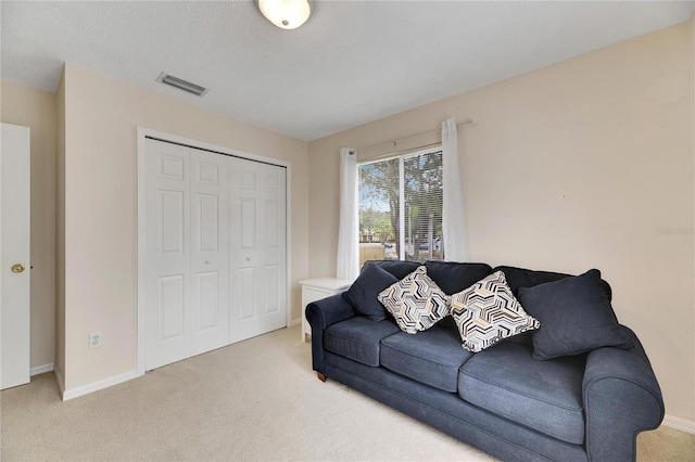 living room featuring light colored carpet