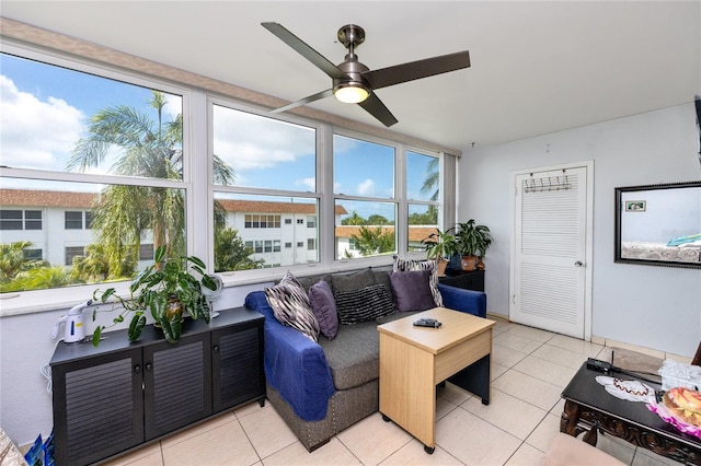 interior space featuring ceiling fan and light tile patterned floors