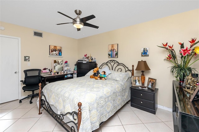 bedroom with ceiling fan and light tile patterned flooring