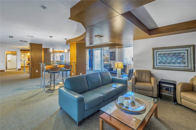 living room with carpet flooring and visible vents