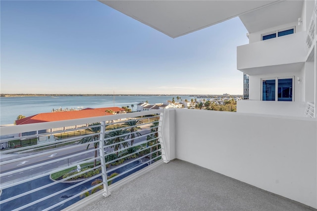 balcony featuring a water view