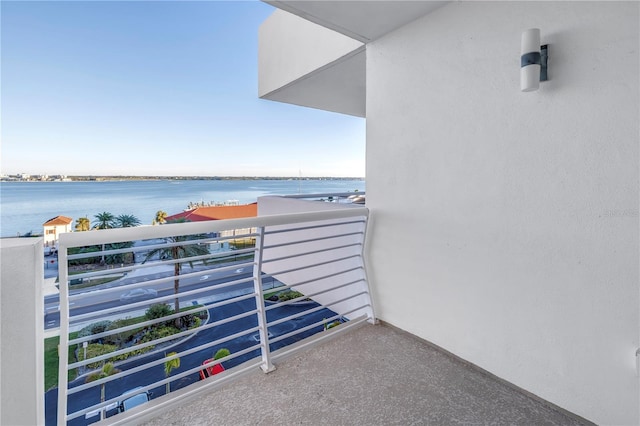 balcony featuring a water view