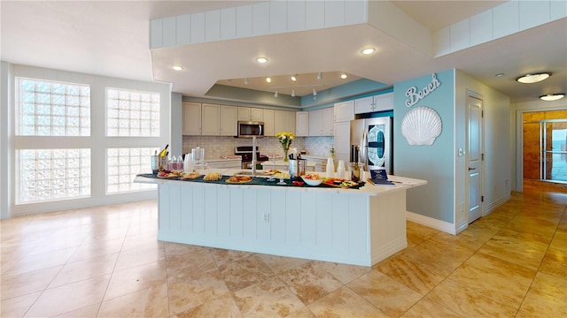 kitchen with tasteful backsplash, baseboards, light tile patterned floors, recessed lighting, and stainless steel appliances