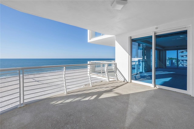 balcony with a view of the beach and a water view
