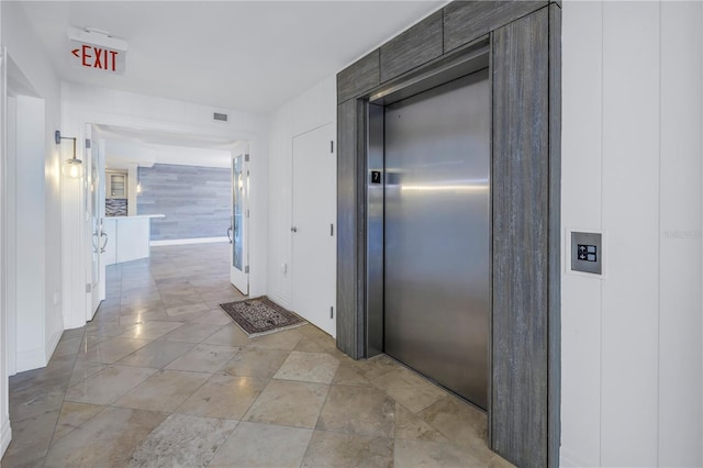 corridor featuring elevator