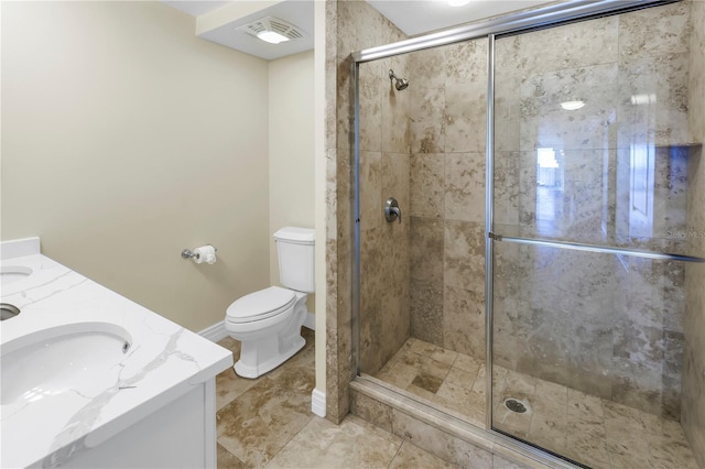 full bath with a sink, toilet, a stall shower, visible vents, and double vanity