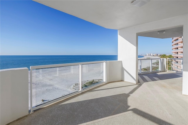 balcony featuring a water view