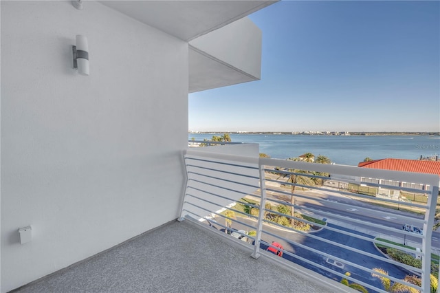 balcony featuring a water view