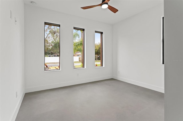 unfurnished room with ceiling fan