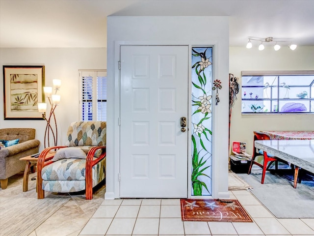 foyer with light tile patterned floors