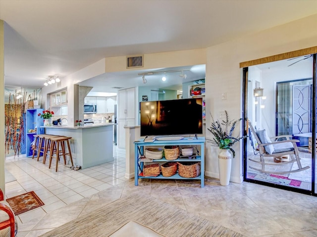 living room featuring light tile patterned flooring