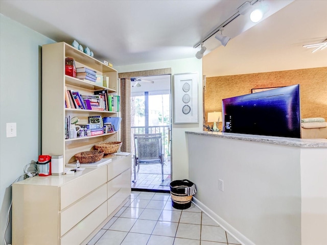 kitchen featuring light tile patterned flooring and rail lighting