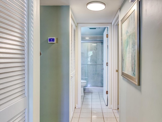 hallway featuring light tile patterned floors