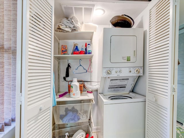 washroom featuring stacked washer and dryer