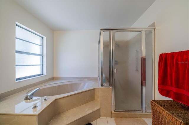 bathroom featuring tile patterned floors and plus walk in shower