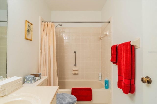 full bathroom featuring vanity, shower / bath combination with curtain, and toilet