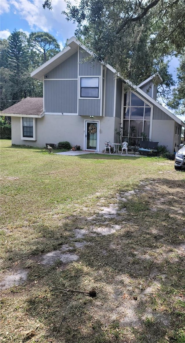 view of property exterior with a yard