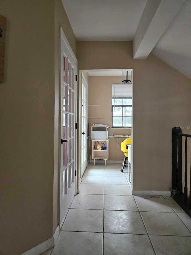 corridor featuring light tile patterned floors