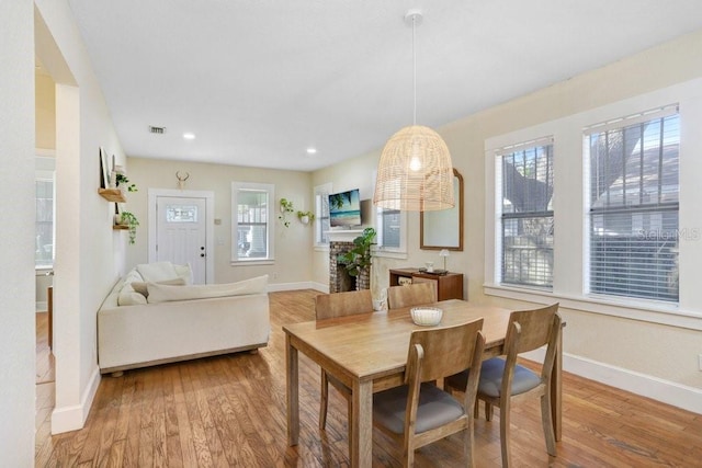 dining space featuring light wood-type flooring