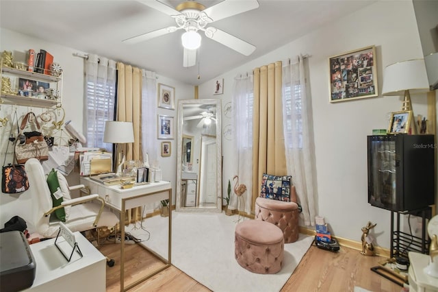 office featuring hardwood / wood-style flooring and ceiling fan