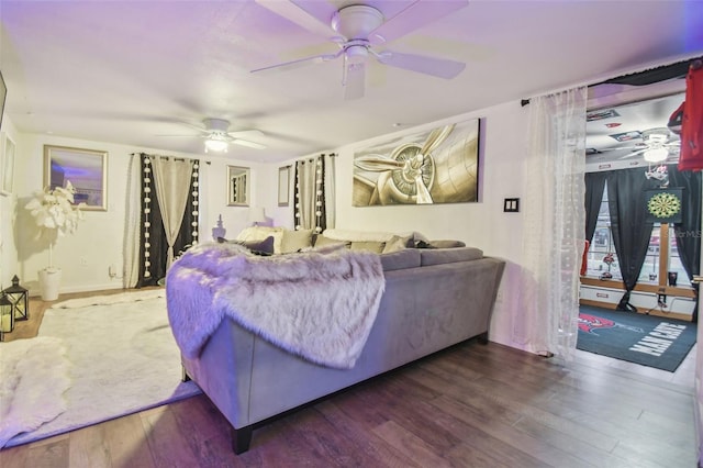 living room with ceiling fan and dark hardwood / wood-style floors