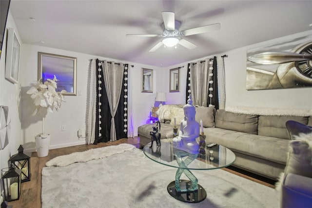 living room with dark hardwood / wood-style floors and ceiling fan