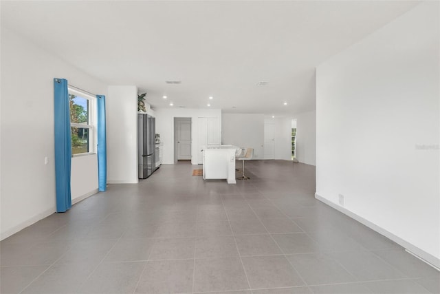 interior space featuring light tile patterned floors