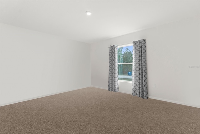 unfurnished room featuring carpet floors