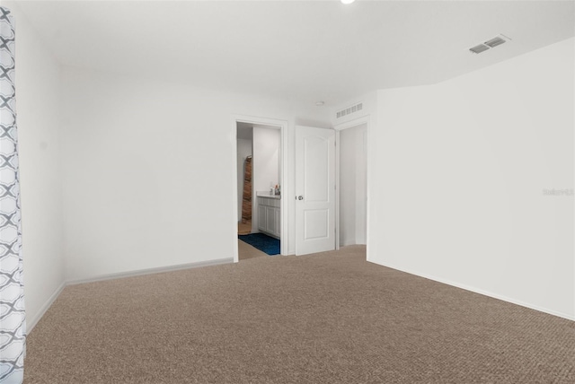 unfurnished room featuring carpet floors